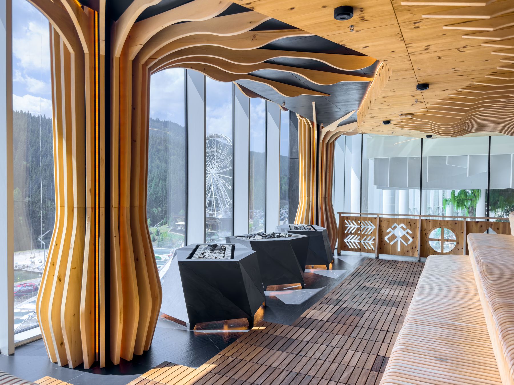 Resort sauna with organic wooden columns and a panoramic view